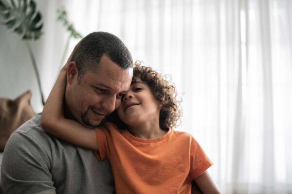 Man and Child hugging | Substance Use Treatment Emergence | Addiction and Behavioral Therapies in Oregon